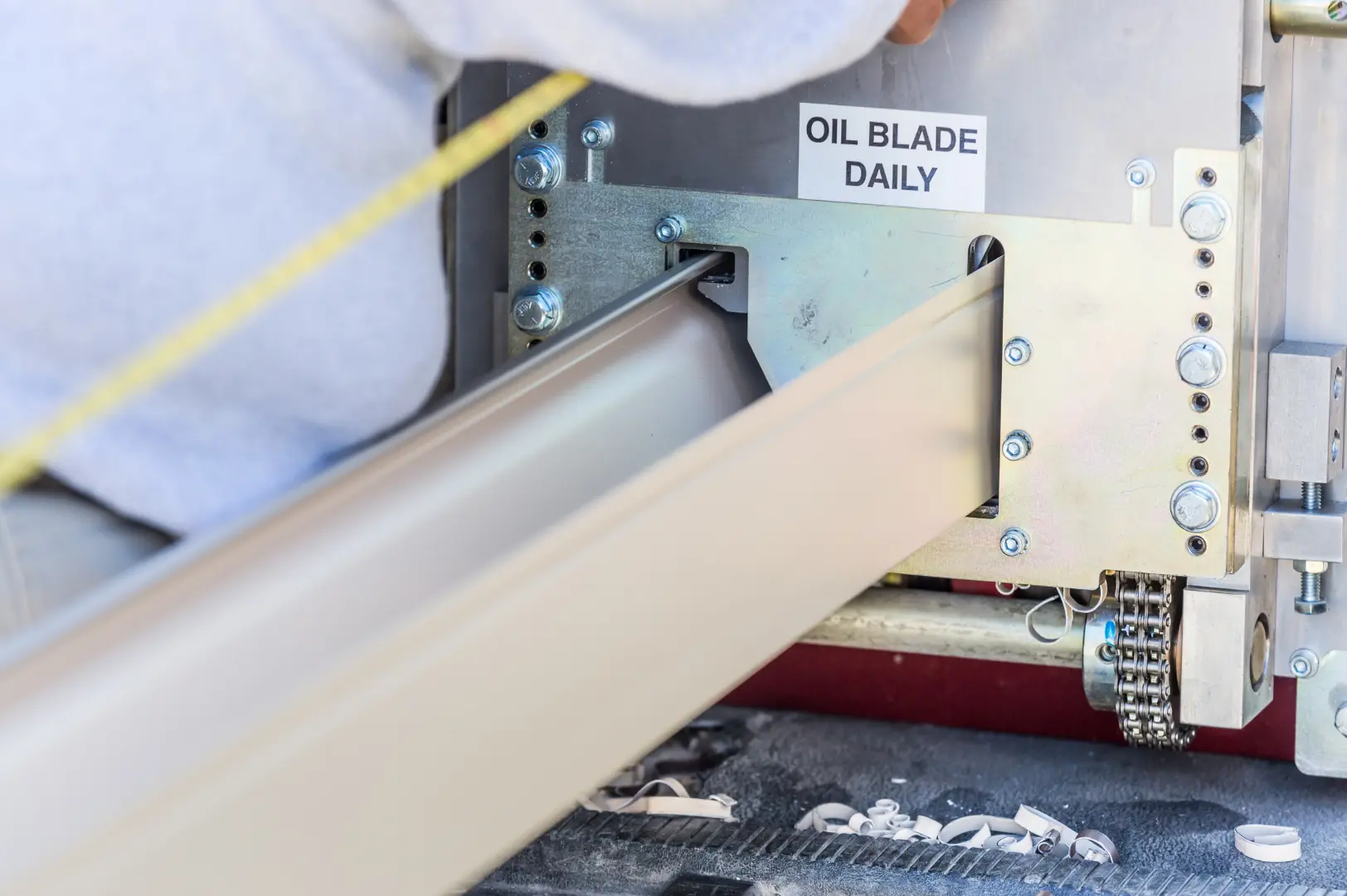 Close-up of an on-site gutter manufacturing process