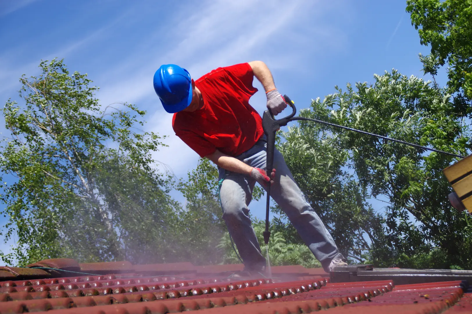 Roof-cleaning professional pressure washing tiled roofing